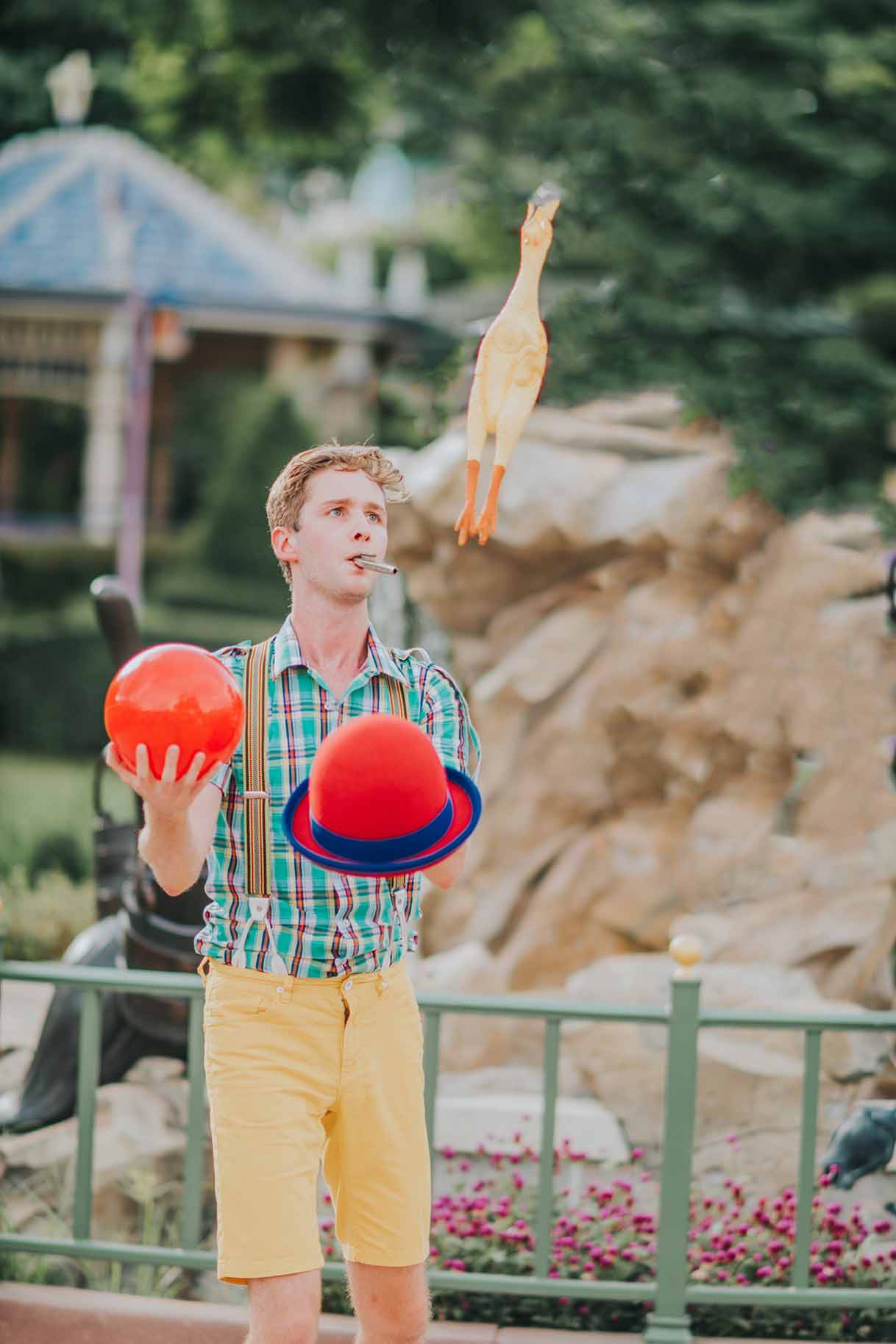 childrens entertainer juggling hat and ball in a magic show